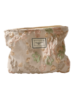 Saco de maquilhagem em tecido brocado floral cor-de-rosa Saco de maquilhagem em tecido brocado floral cor-de-rosa
