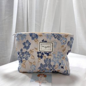 Trousse de maquillage femme motif floral en relief bleue