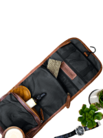 Foldable brown leather toiletry bag presentation picture Foldable brown leather toiletry bag presentation picture