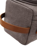 Men's toiletry bag in canvas with leather inserts and outside pocket in solid color with handle details Men's toiletry bag in canvas with leather inserts and outside pocket in solid color with handle details