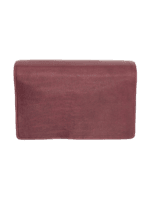 Trousse de toilette femme à suspendre en cuir rouge repliée vue dessus