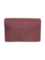 Trousse de toilette femme à suspendre en cuir rouge repliée vue dessus