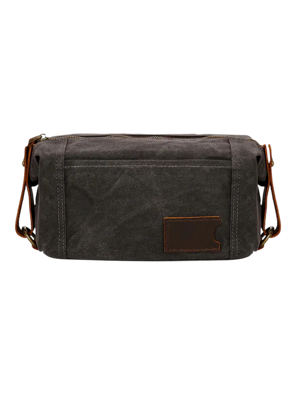 Trousse de toilette homme tissu empiècement cuir avec compartiments style brut en couleur noire organisation efficace des objets personnels
